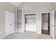 Versatile bedroom featuring built-in storage and easy access to additional rooms at 115 Graystone Terrace Ter, Alpharetta, GA 30005