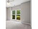 Cozy bedroom with natural light and neutral carpet flooring at 115 Graystone Terrace Ter, Alpharetta, GA 30005