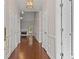Entryway with hardwood floors leading to a spacious living area at 115 Graystone Terrace Ter, Alpharetta, GA 30005