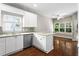 Well-lit kitchen with stainless steel appliances and a breakfast bar overlooking the living area at 115 Graystone Terrace Ter, Alpharetta, GA 30005