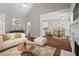 Inviting living room featuring hardwood floors, fireplace, and comfortable furnishings at 115 Graystone Terrace Ter, Alpharetta, GA 30005