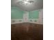 Spacious bedroom with hardwood floors, wainscoting, and a ceiling fan at 3770 Falling Leaf Ln, Cumming, GA 30041
