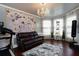Bonus room with exercise equipment, large floral art, and stylish décor at 3770 Falling Leaf Ln, Cumming, GA 30041