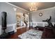 Bonus room featuring exercise equipment, wainscoting and stylish decor at 3770 Falling Leaf Ln, Cumming, GA 30041