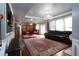 Open floorplan with living room and dining area, large rug, and comfortable seating at 3770 Falling Leaf Ln, Cumming, GA 30041