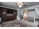 Bright living room features brick accent wall with modern décor and a staircase at 3770 Falling Leaf Ln, Cumming, GA 30041