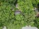 Aerial view of a charming property nestled among lush trees, featuring a home and guest house at 55 Cooper Lake Rd, Mableton, GA 30126