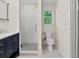 Bathroom showcasing a glass enclosed shower, neutral color palette and bright gold hardware at 55 Cooper Lake Rd, Mableton, GA 30126