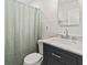 Bathroom featuring a marble vanity top, tiled walls, and a shower with a patterned curtain at 55 Cooper Lake Rd, Mableton, GA 30126