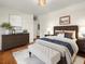 Bedroom featuring hardwood floors, neutral colored walls, and modern furnishings at 55 Cooper Lake Rd, Mableton, GA 30126