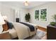 Bedroom featuring a neutral color palette, ensuite bathroom, and an abundance of natural light at 55 Cooper Lake Rd, Mableton, GA 30126