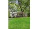 Charming bungalow with a welcoming front porch, light gray siding, and well-manicured lawn in a serene setting at 55 Cooper Lake Rd, Mableton, GA 30126
