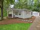 Charming home featuring a covered porch, walkway, and detached garage at 55 Cooper Lake Rd, Mableton, GA 30126