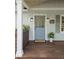 Inviting front porch featuring a stylish blue door, classic lighting, and a 'Welcome' mat on a wooden deck at 55 Cooper Lake Rd, Mableton, GA 30126