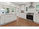 Bright kitchen featuring white cabinets, stainless steel appliances, modern fixtures, and attractive vinyl flooring at 55 Cooper Lake Rd, Mableton, GA 30126