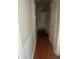 Hallway with hardwood floors and white wainscoting at 726 Shoreline Se Trl, Conyers, GA 30094