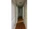 Hallway with hardwood floors and white wainscoting at 726 Shoreline Se Trl, Conyers, GA 30094