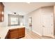 Bright eat-in kitchen with wood cabinets, white countertops, light gray paint and wood floors at 909 Pine Cove Dr, Lilburn, GA 30047