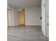 Spacious unfinished basement with modern gray wood floors and neutral walls at 1917 Penelope Nw Rd, Atlanta, GA 30314