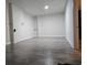 An unfinished basement features gray wood flooring at 1917 Penelope Nw Rd, Atlanta, GA 30314