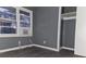 Bedroom with grey walls, grey flooring, and closet at 1917 Penelope Nw Rd, Atlanta, GA 30314
