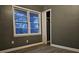 Comfortable bedroom with natural light and a closet at 1917 Penelope Nw Rd, Atlanta, GA 30314