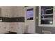 Kitchen featuring white cabinets, gray walls, and modern flooring at 1917 Penelope Nw Rd, Atlanta, GA 30314