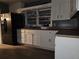 This kitchen has a stainless steel refrigerator and white cabinets for a modern design at 1917 Penelope Nw Rd, Atlanta, GA 30314