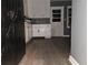 Kitchen featuring white cabinets, gray walls, and modern flooring at 1917 Penelope Nw Rd, Atlanta, GA 30314