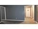 A minimalist living room with gray walls and modern flooring at 1917 Penelope Nw Rd, Atlanta, GA 30314