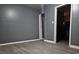 A minimalist living room with gray walls and modern flooring at 1917 Penelope Nw Rd, Atlanta, GA 30314