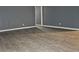 A minimalist living room with gray walls and modern flooring at 1917 Penelope Nw Rd, Atlanta, GA 30314