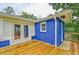 Cozy backyard deck with wooden floor and a blue brick house at 2011 Lexington Ave, Atlanta, GA 30344