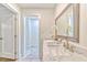 Clean bathroom with marble countertop, large mirror, and modern fixtures at 2011 Lexington Ave, Atlanta, GA 30344