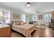 Inviting main bedroom featuring hardwood floors, natural light, and stylish furnishings at 2011 Lexington Ave, Atlanta, GA 30344