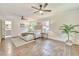 Spacious main bedroom with hardwood floors, ceiling fans, and ensuite bathroom at 2011 Lexington Ave, Atlanta, GA 30344