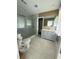 Beautiful bathroom with tiled walk-in shower, modern fixtures and double sink vanity at 6900 Rockland Rd, Stonecrest, GA 30038