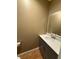 Cozy bathroom features a gray vanity with brushed nickel hardware at 6900 Rockland Rd, Stonecrest, GA 30038