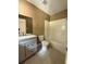 Updated bathroom with double vanity, tub-shower combination and tile flooring at 6900 Rockland Rd, Stonecrest, GA 30038