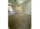 Neutral bedroom with neutral carpet, curtains, fan and large window at 6900 Rockland Rd, Stonecrest, GA 30038