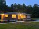 Charming brick home with manicured front yard and new landscaping at 6900 Rockland Rd, Stonecrest, GA 30038
