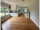 Bright kitchen features white cabinets, modern appliances, and hardwood floors at 6900 Rockland Rd, Stonecrest, GA 30038