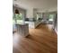 Bright kitchen features modern white cabinets, stainless steel appliances, and a large island at 6900 Rockland Rd, Stonecrest, GA 30038