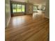 Bright and inviting living area featuring hardwood floors and a seamless flow into the kitchen at 6900 Rockland Rd, Stonecrest, GA 30038