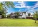 Large backyard with a covered patio, perfect for outdoor entertaining and relaxation at 8320 Mayfern Dr, Fairburn, GA 30213