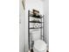 Neutral half bathroom includes white toilet with storage rack at 8320 Mayfern Dr, Fairburn, GA 30213