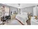 Charming bedroom boasts soft carpet, a ceiling fan, and a bright window for lots of natural light at 8320 Mayfern Dr, Fairburn, GA 30213