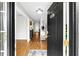 Inviting foyer with hardwood floors, a view into other rooms, and neutral decor at 8320 Mayfern Dr, Fairburn, GA 30213