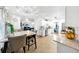 Open eat-in kitchen with white cabinets and stainless steel appliances perfect for entertaining at 8320 Mayfern Dr, Fairburn, GA 30213
