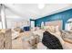 Spacious bedroom with elegant decor, highlighted by a beautiful blue accent wall and stylish furnishings at 8320 Mayfern Dr, Fairburn, GA 30213